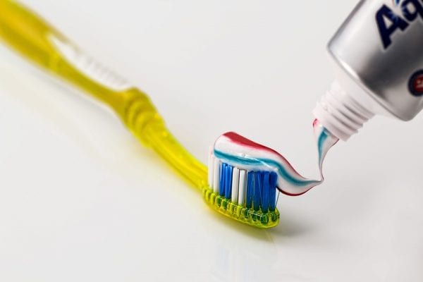 toothbrush with toothpaste in handle